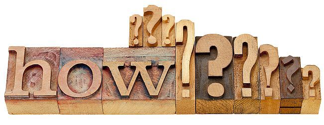 how question - isolated vintage wood letterpress printing blocks with multiple question marks